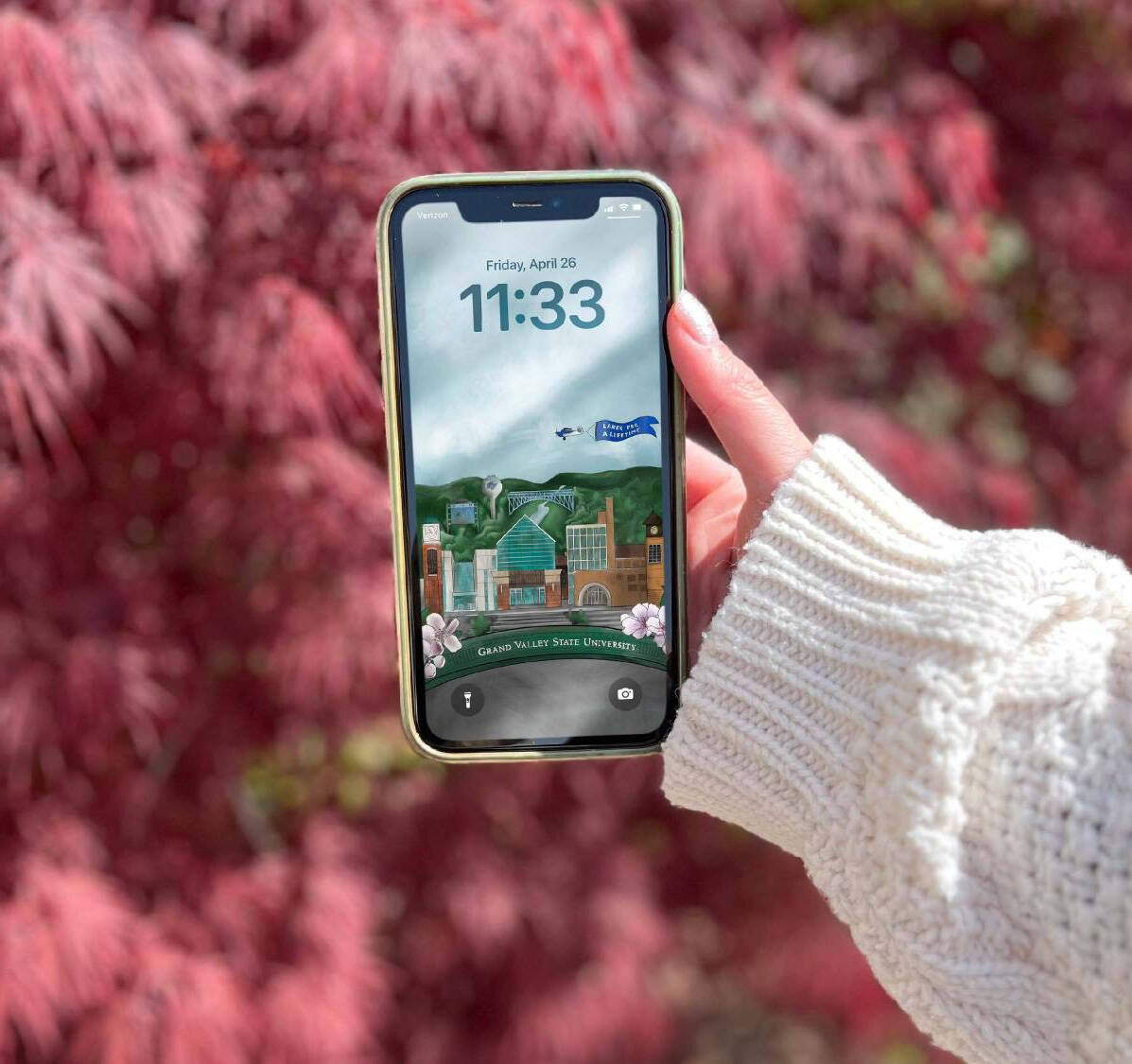 Mobile phone with a GVSU background screen